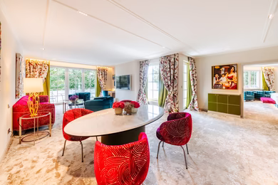 Living room/dining room in the Seefels Corner Suite