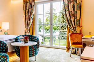 Wohnbespiel Doppelzimmer mit Balkon und Seeblick