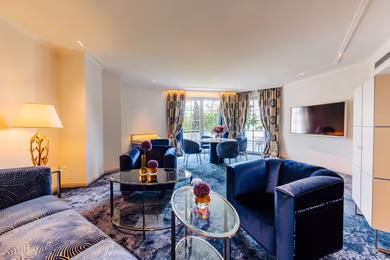 Living room/dining room in the Grand Park Suite